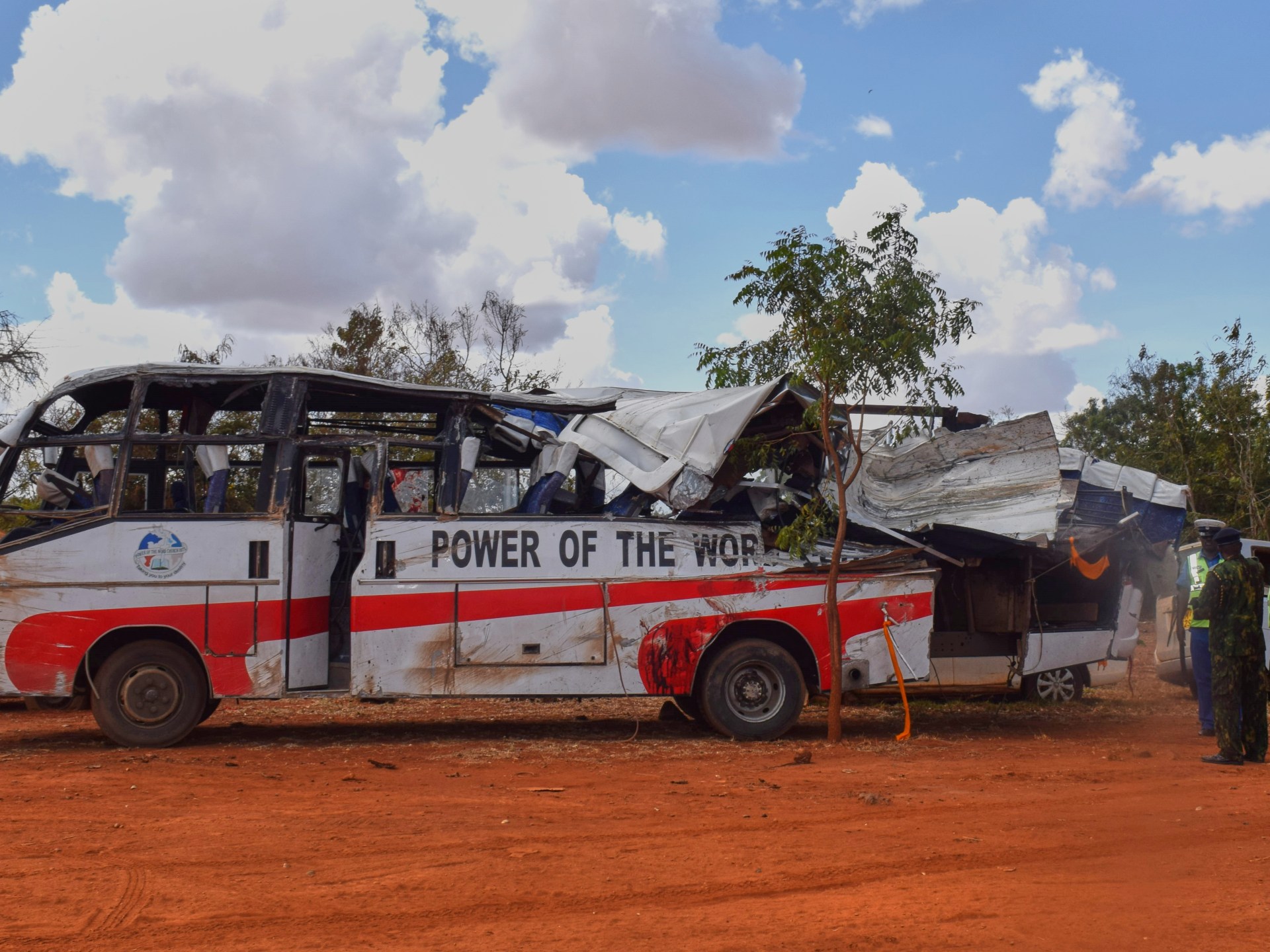 At least 24 killed as a bus carrying mourners hits a cement truck in Kenya