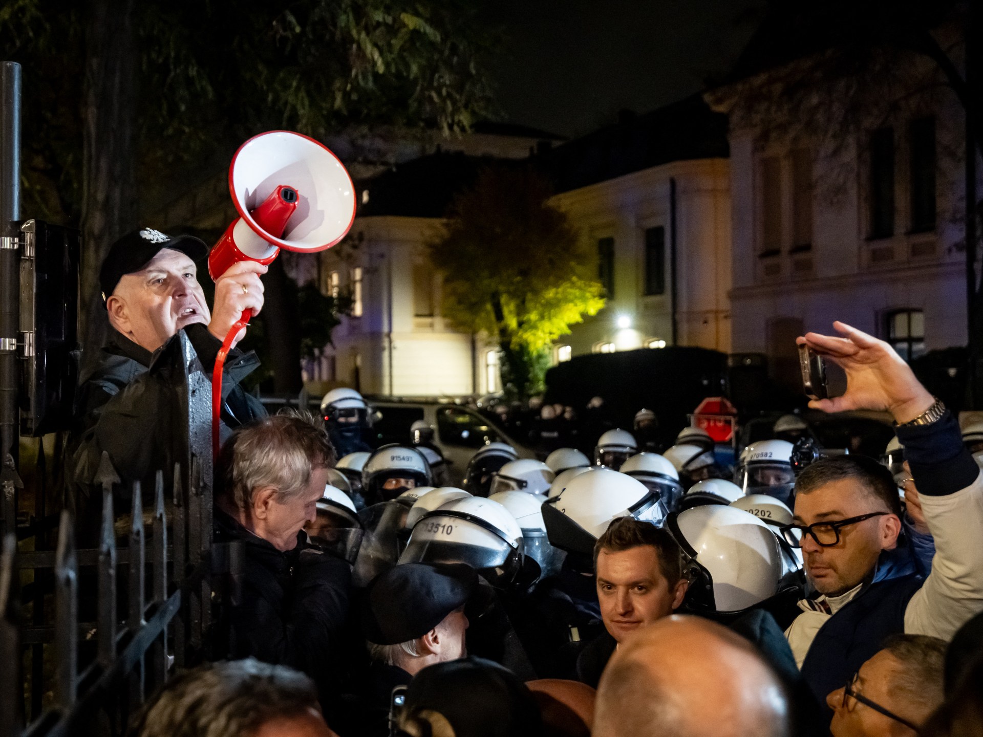 Riot police deployed at Poland's Constitutional Tribunal after its head is suspended